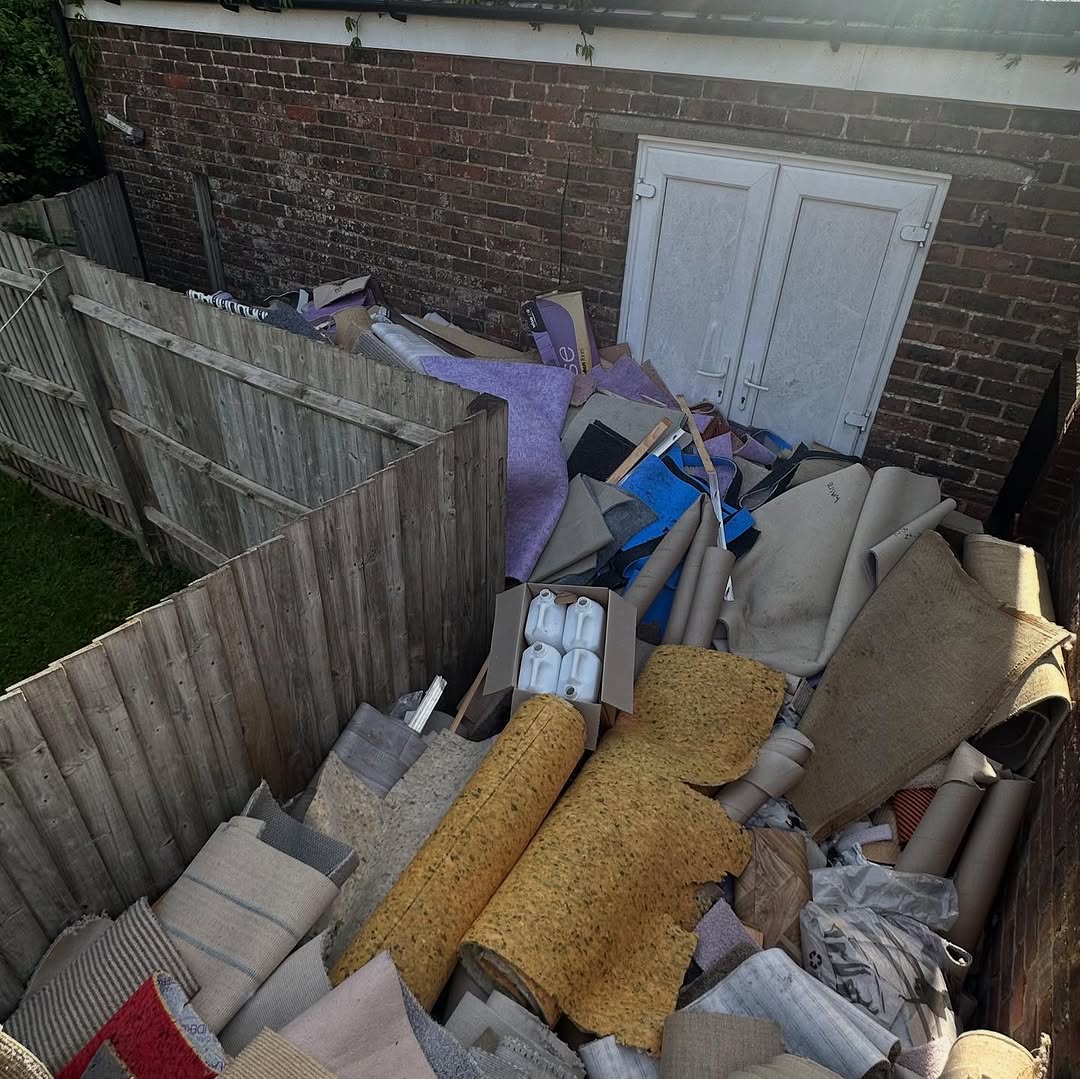 Carpets and rugs awaiting house clearance collection