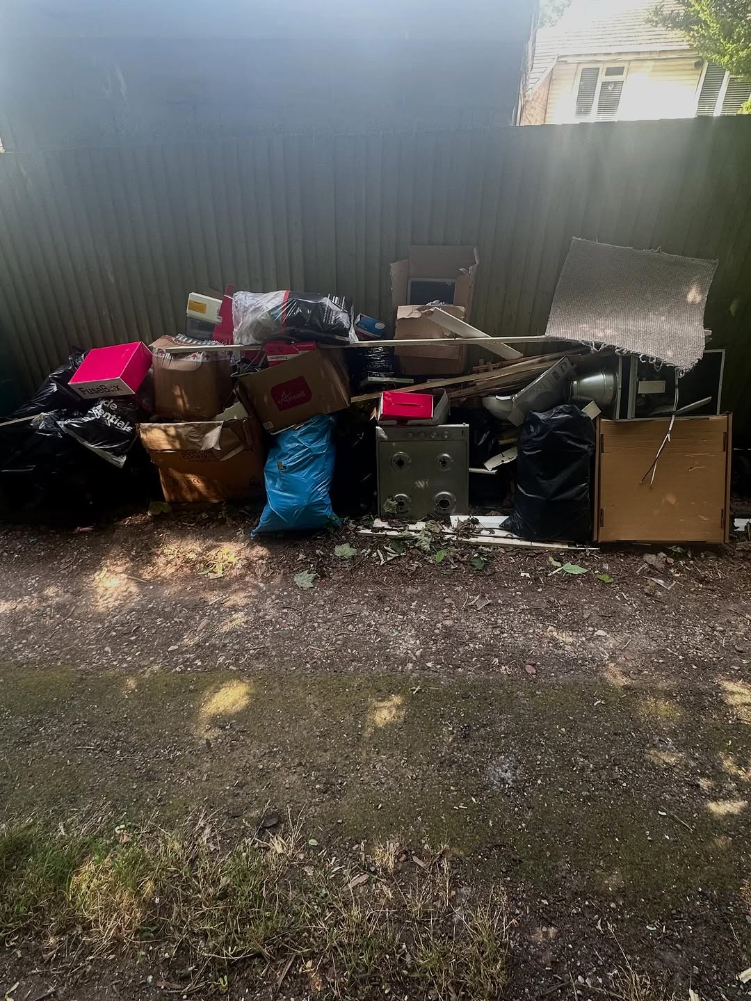 Boxes, bags and old safe ready for domestic clearance