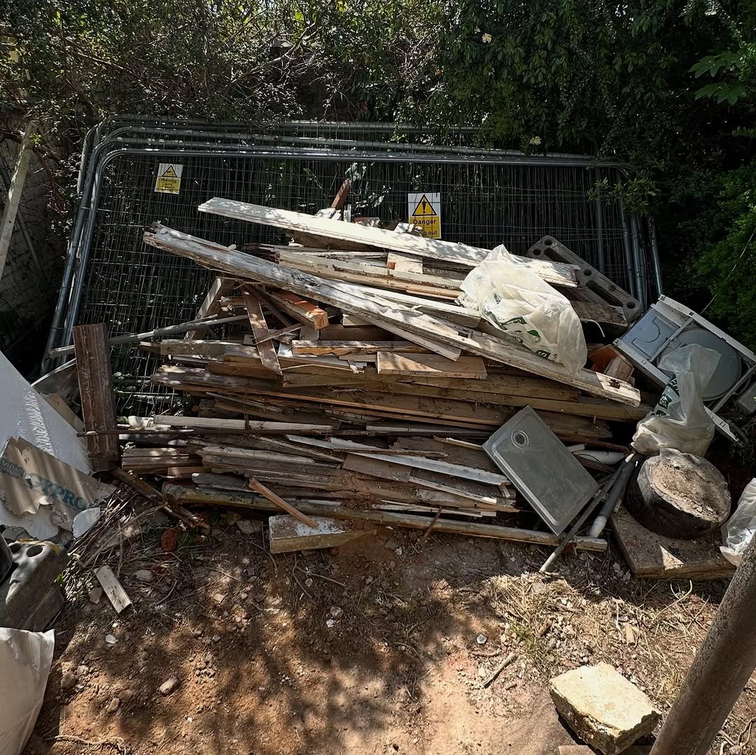 Timber and wood waste pile awaiting clearance